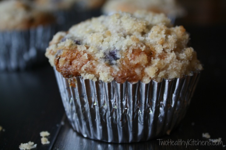 These make-over Blueberry-White Chocolate Muffins are a blissfully decadent indulgence ... without all the guilt! So unbelievably scrumptious – yet full of healthy upgrades like whole wheat flour and much less fat, plus plenty of super-nutritious blueberries. These white chocolate muffins are a great breakfast, grab-n-go snack or even a healthy dessert. And, they freeze well, too! | www.TwoHealthyKitchens.com