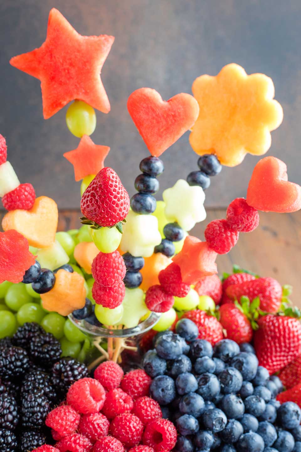 Closeup of a fruit bouquet in the middle of a fruit tray.