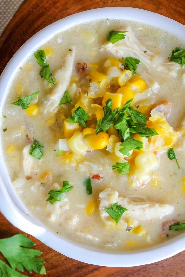 closeup overhead of about 2/3 of a bowl of this corn chowder in a white bowl