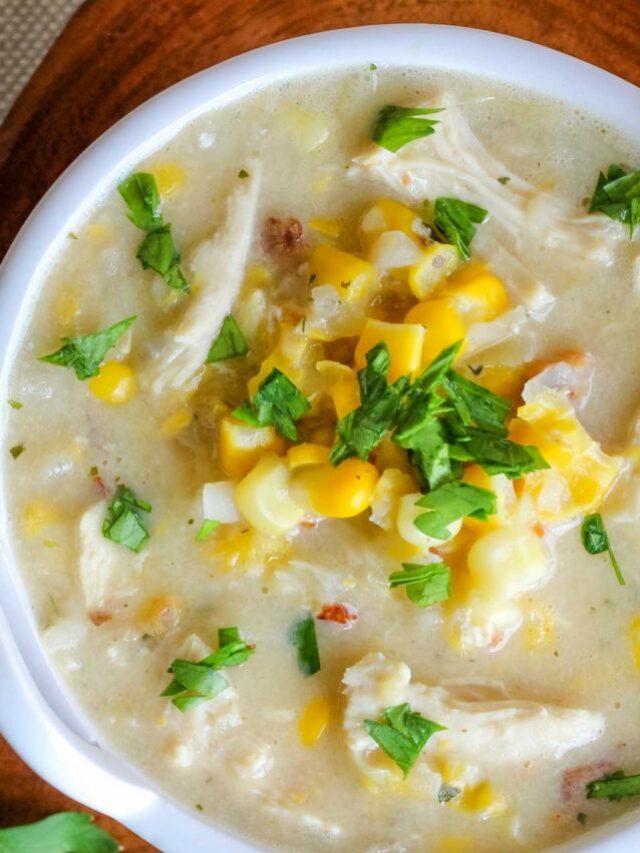 closeup overhead of about 2/3 of a bowl of this corn chowder in a white bowl