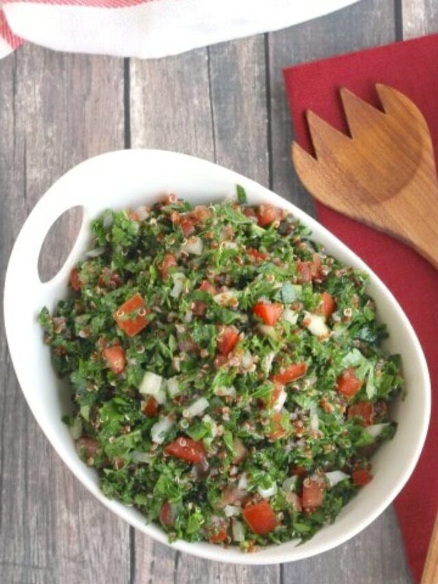 Overhead of pile of quinoa in white serving bowl.