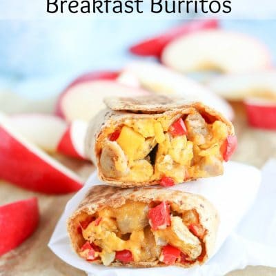 2 halves stacked on top of each other to show filling; text overlay "Freezable! Chicken-Apple Sausage Breakfast Burritos".