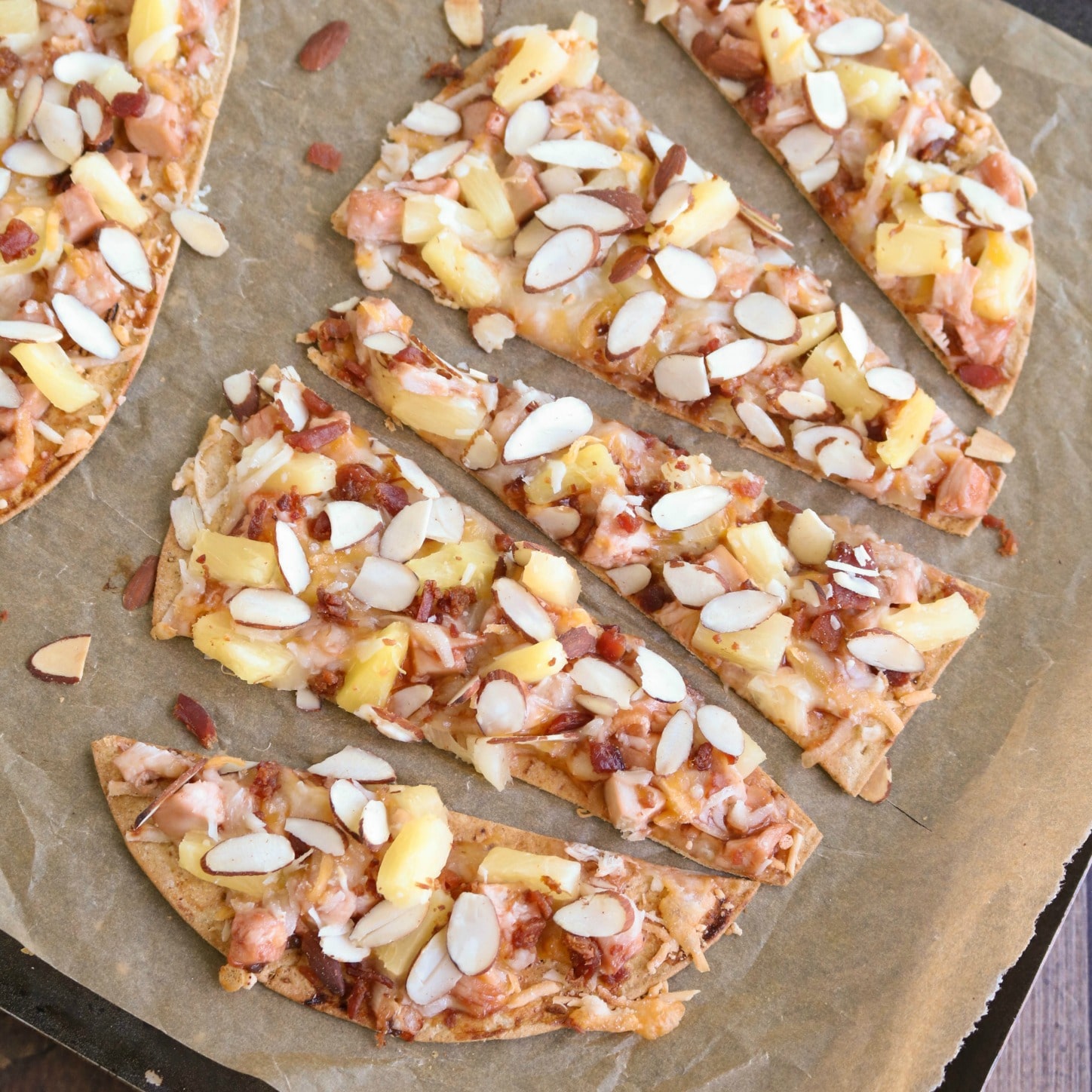 This Sweet and Sour Chicken Flatbread Pizza is so many awesome things in one! It’s like your favorite Chinese sweet and sour chicken met up with a BBQ chicken pizza … all on top of a crispy flatbread crust! Bonus: it’s ready in way under 30 minutes! | www.TwoHealthyKitchens.com