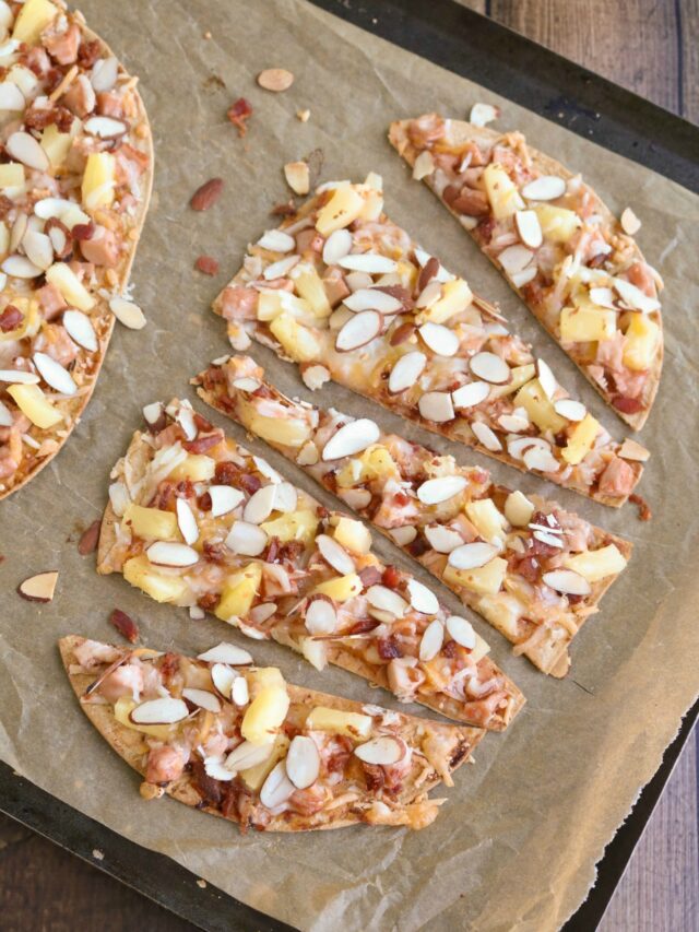 Overhead of one flatbread cut into 5 triangular slices.