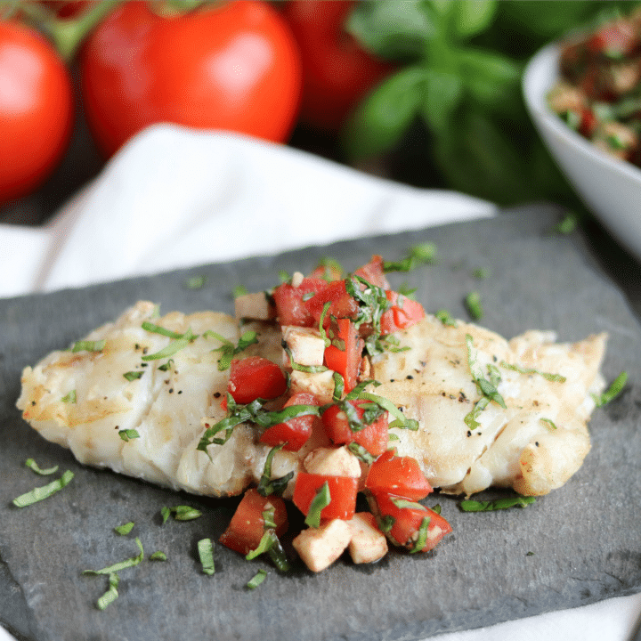 Caprese Grilled Fish is super simple yet incredibly delicious - perfect with summer’s best tomatoes and basil! An easy grilling recipe for cookouts or casual family suppers! | www.TwoHealthyKitchens.com