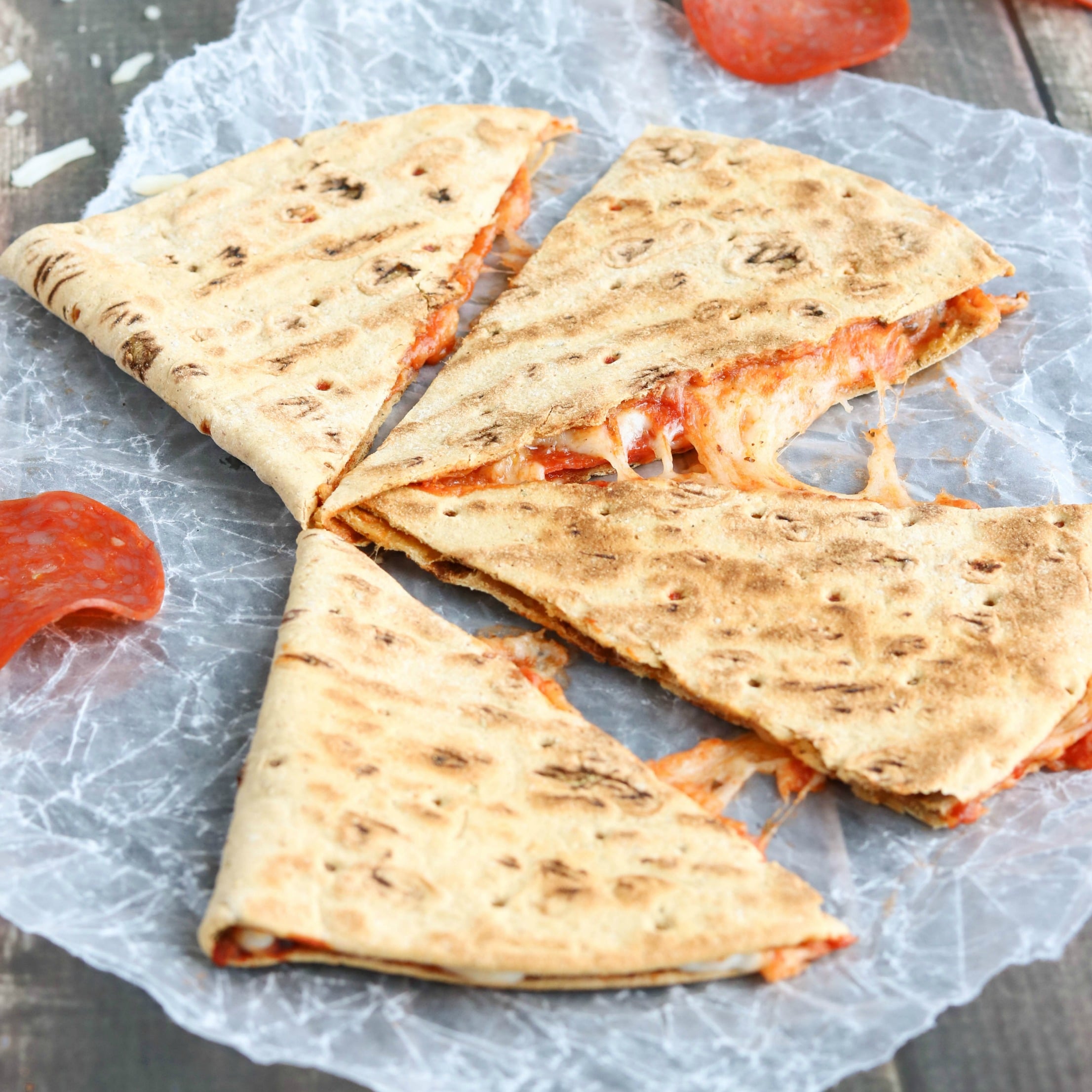 This easy Pepperoni Pizza Quesadilla recipe takes just minutes! With fiber-rich whole grains and lots of protein, it’s perfect as a quick meal or a hearty power snack! | www.TwoHealthyKitchens.com