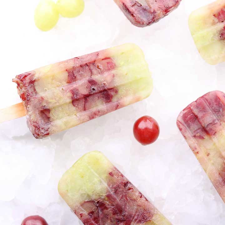 Frozen grapes are deliciously transformed into perfectly simple, amazingly refreshing popsicles! So easy to make! My absolute favorite summer post-workout snack! | www.TwoHealthyKitchens.com