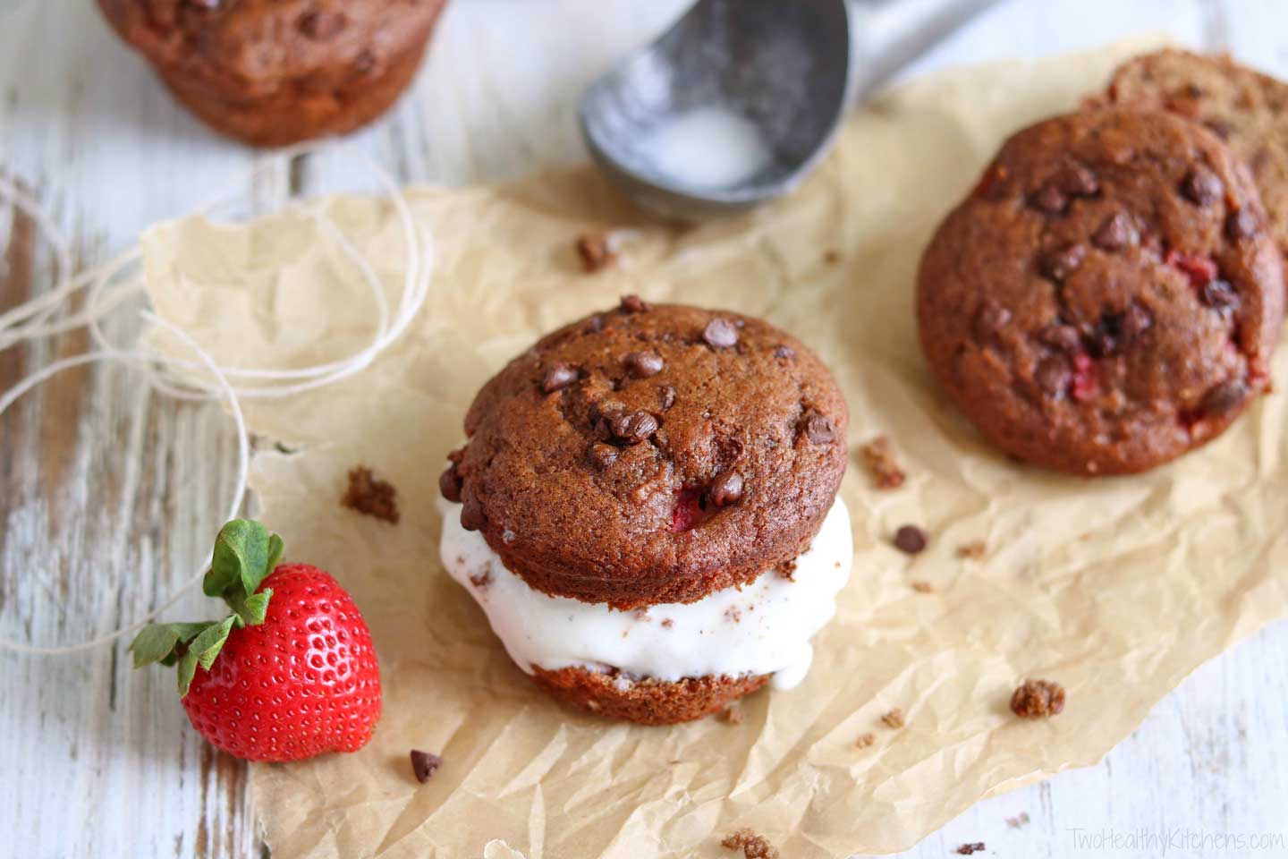 Take delicious, healthy breakfast muffins … add ice cream … and you’ve got a decadent dessert! Muffin ice cream sandwiches! Bursting with fresh strawberries and double chocolate! One batch of muffins = two great recipes! | www.TwoHealthyKitchens.com