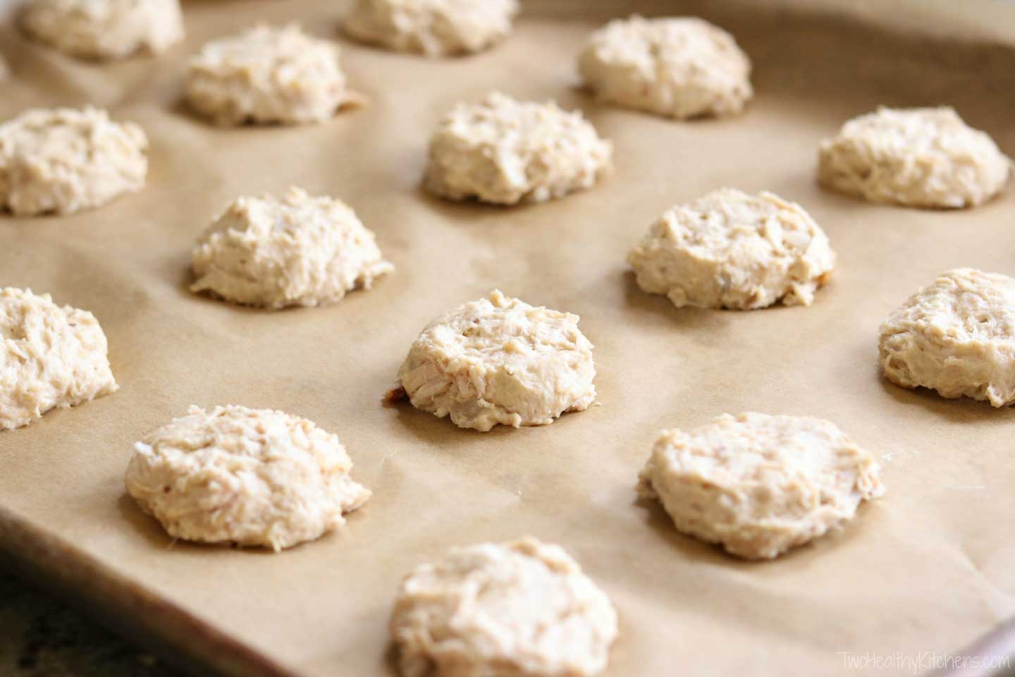 Perfect for using up leftover chicken! These easy Homemade Dog Treats are the doggy version of that classic comfort food, chicken and biscuits! Just store your leftover chicken in the freezer until you’re ready to make these healthy dog treats. And there’s no need to fuss with cookie cutters – these easy drop biscuits are so much faster! With just 4 ingredients, this dog treat recipe is ultra quick and easy, and these store beautifully in the freezer for weeks! | www.TwoHealthyKitchens.com