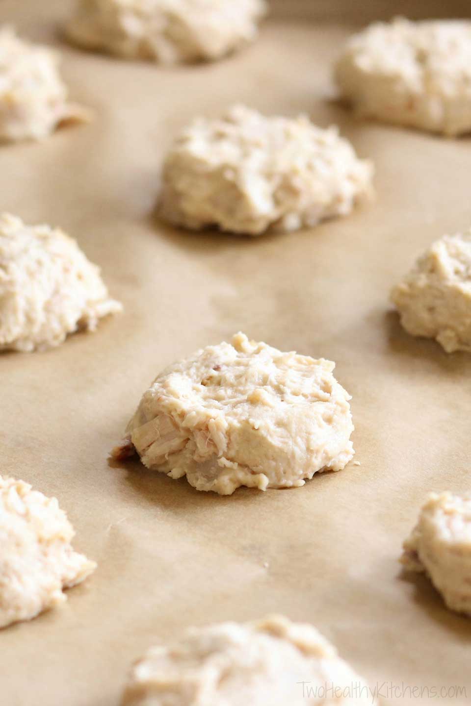 closeup of dog treats on parchment-lined baking sheet