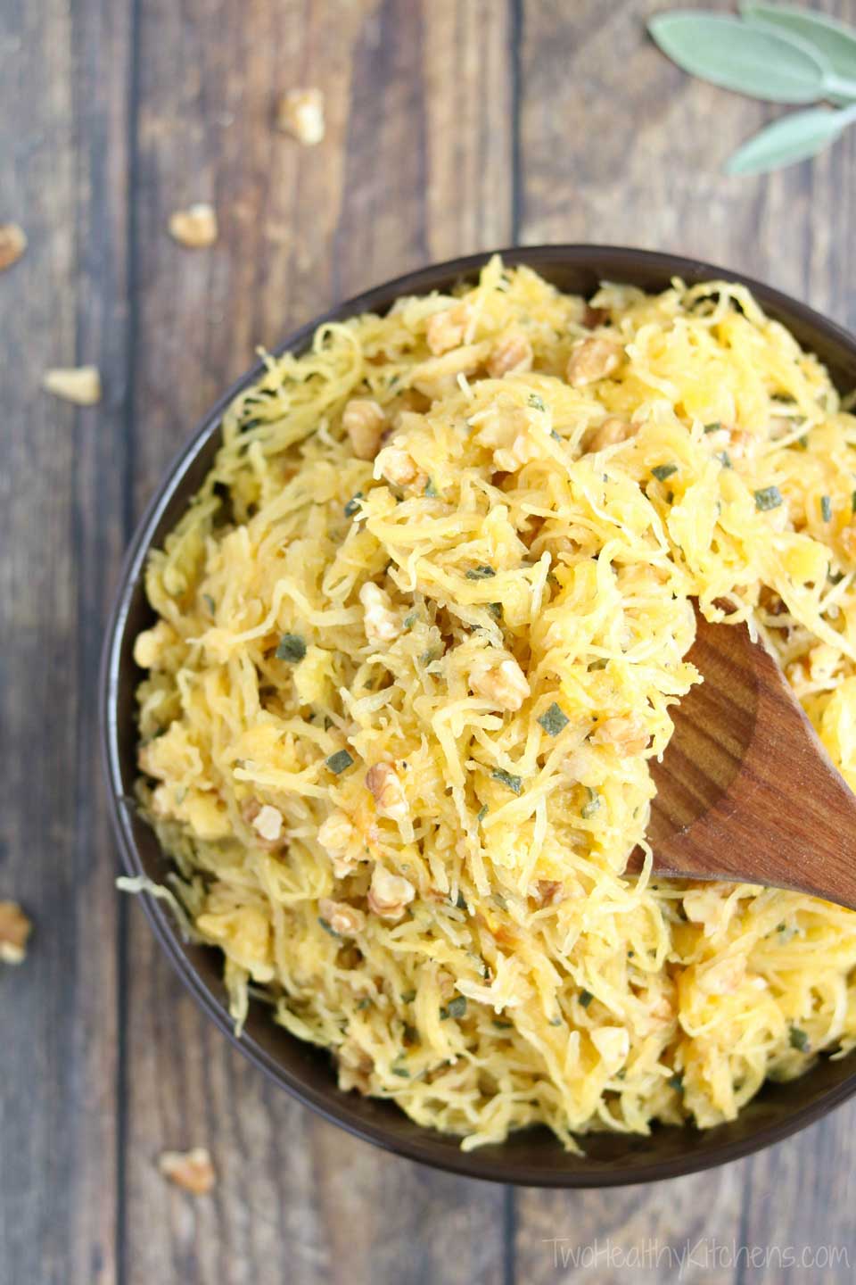 This fantastic recipe for Microwave Spaghetti Squash is easy enough for weeknights, but impressive enough for Thanksgiving dinner and holiday buffets! Rich browned butter with crunchy, toasted walnuts and fragrant sage - amazing! With just 5 ingredients, this easy spaghetti squash recipe is a total snap – yet surprisingly, satisfyingly delicious! Lots of easy tips, too – toasting nuts, browning butter, cooking spaghetti squash perfectly, and stuffed spaghetti squash! | www.TwoHealthyKitchens.com