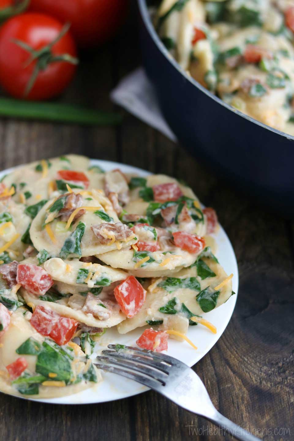 BLT flavor + a 2-cheese “alfredo” sauce make this healthy, quick and easy skillet meal a family favorite! It’s a 30 minute meal that can even be made ahead and quickly re-warmed later! Our Cheesy BLT Pierogi Skillet Dinner recipe is true comfort food with a satisfyingly fresh twist! Pillowy soft pierogies are draped in a creamy, rich and cheesy sauce and loaded up with vibrant BLT flavors! A deliciously healthy pierogi recipe your family will ask for again and again! | www.TwoHealthyKitchens.com