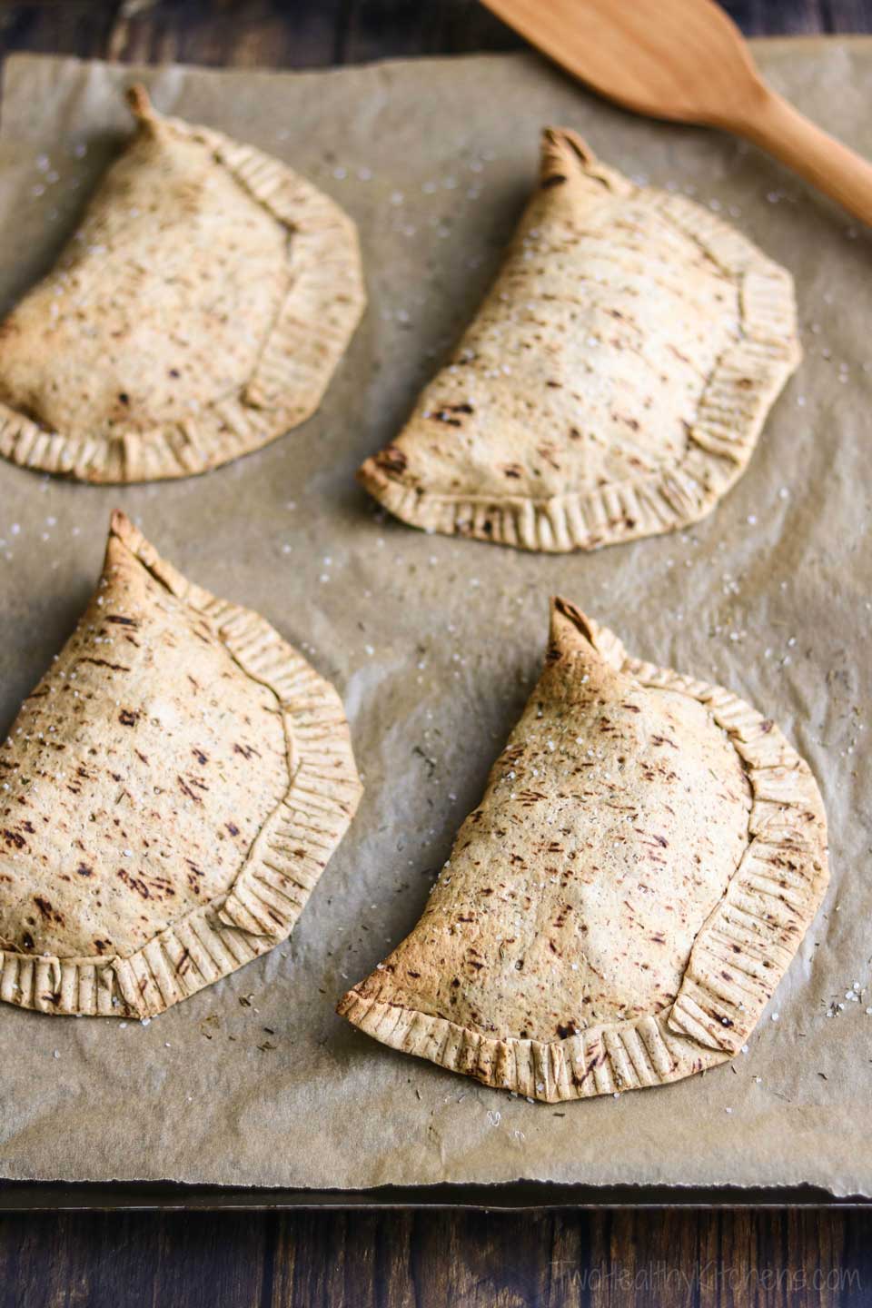 Whole grain flatbreads make for an easy pot pie crust! Our chicken pot pie pockets bake up golden brown and crispy, deliciously seasoned with thyme and coarse salt. It’s this special crust that makes our individual chicken pot pies so perfectly portable! Kinda like healthy, homemade Hot Pockets! | www.TwoHealthyKitchens.com