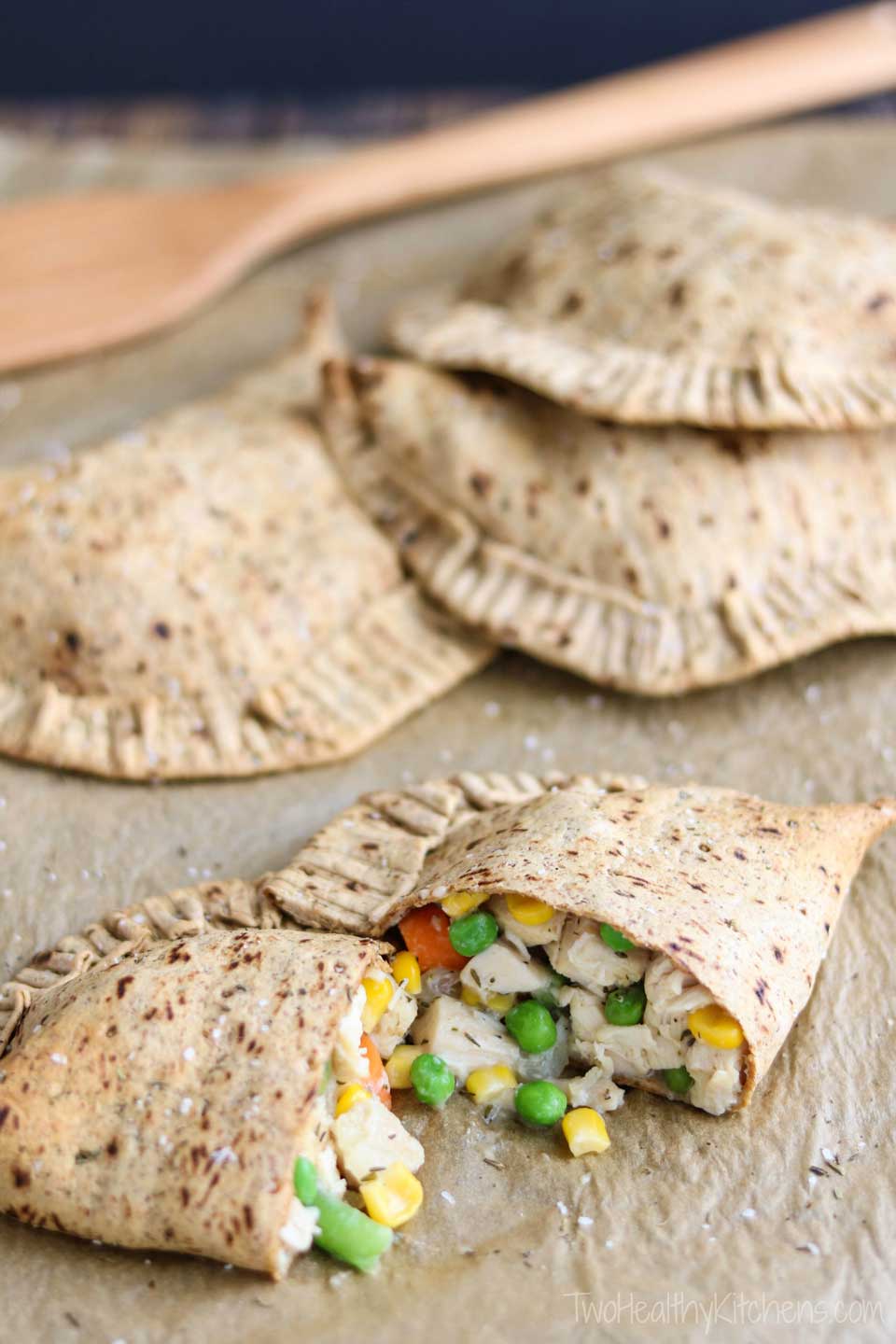 Individual chicken pot pies are so much fun … and so easy to eat on the run! Our easy chicken pot pie recipe makes four hand pies, but you can easily double it so you have plenty to freeze. Because everyone loves chicken pot pie … and timesaving freezer recipes, too! | www.TwoHealthyKitchens.com