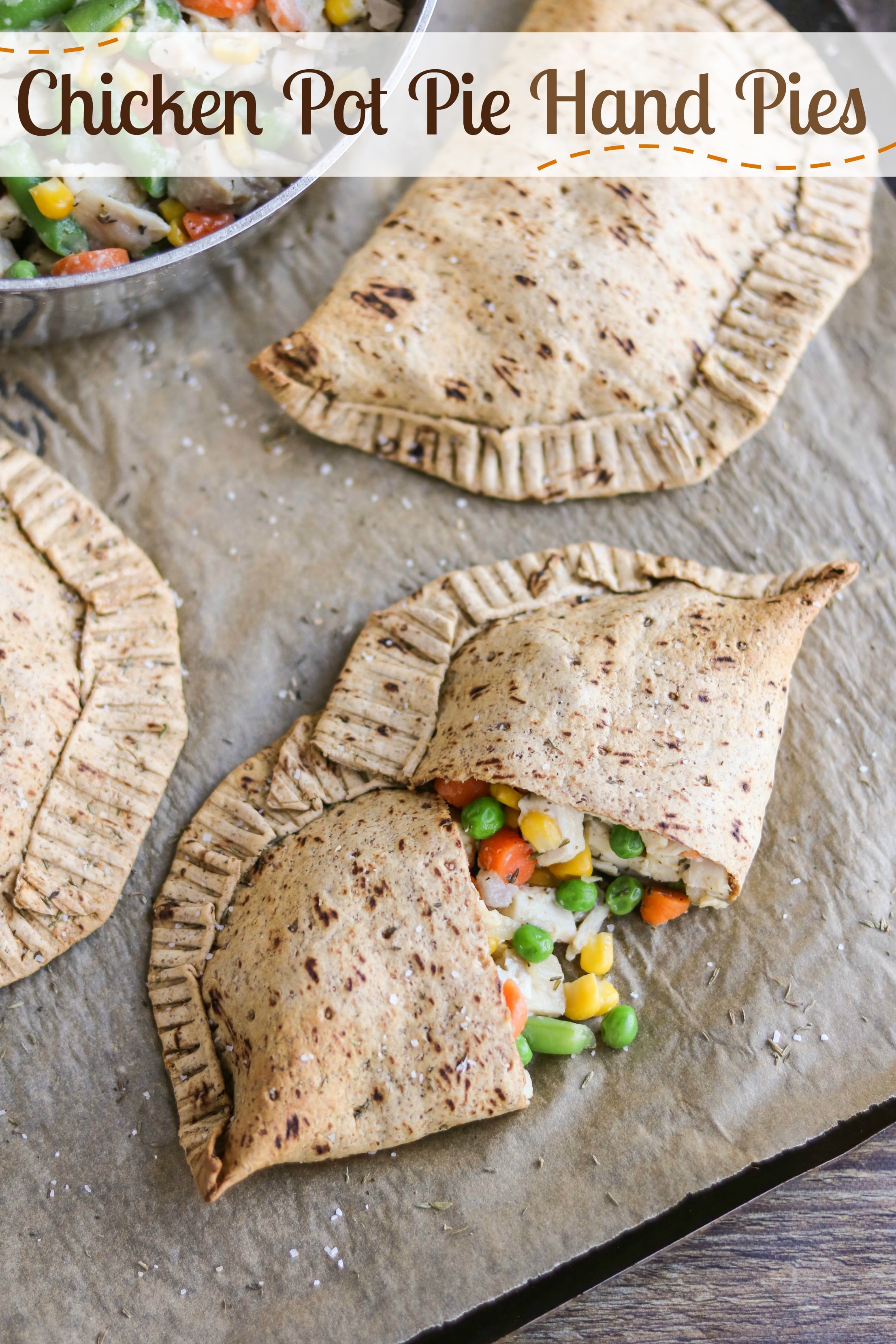 Freezable make-ahead! Perfect grab-and-go meal for busy nights! Our Easy Chicken Pot Pie Hand Pies have all the comforting, homestyle goodness of traditional chicken pot pies, but are more nutritious and totally portable. Filled with yummy (kid-friendly) veggies and chunks of tender white-meat chicken, plus a creamy (but not too messy!) sauce. All wrapped in a healthier, thyme-seasoned pot pie crust. Stock your freezer with healthy homemade "Hot Pockets"! {ad} | www.TwoHealthyKitchens.com