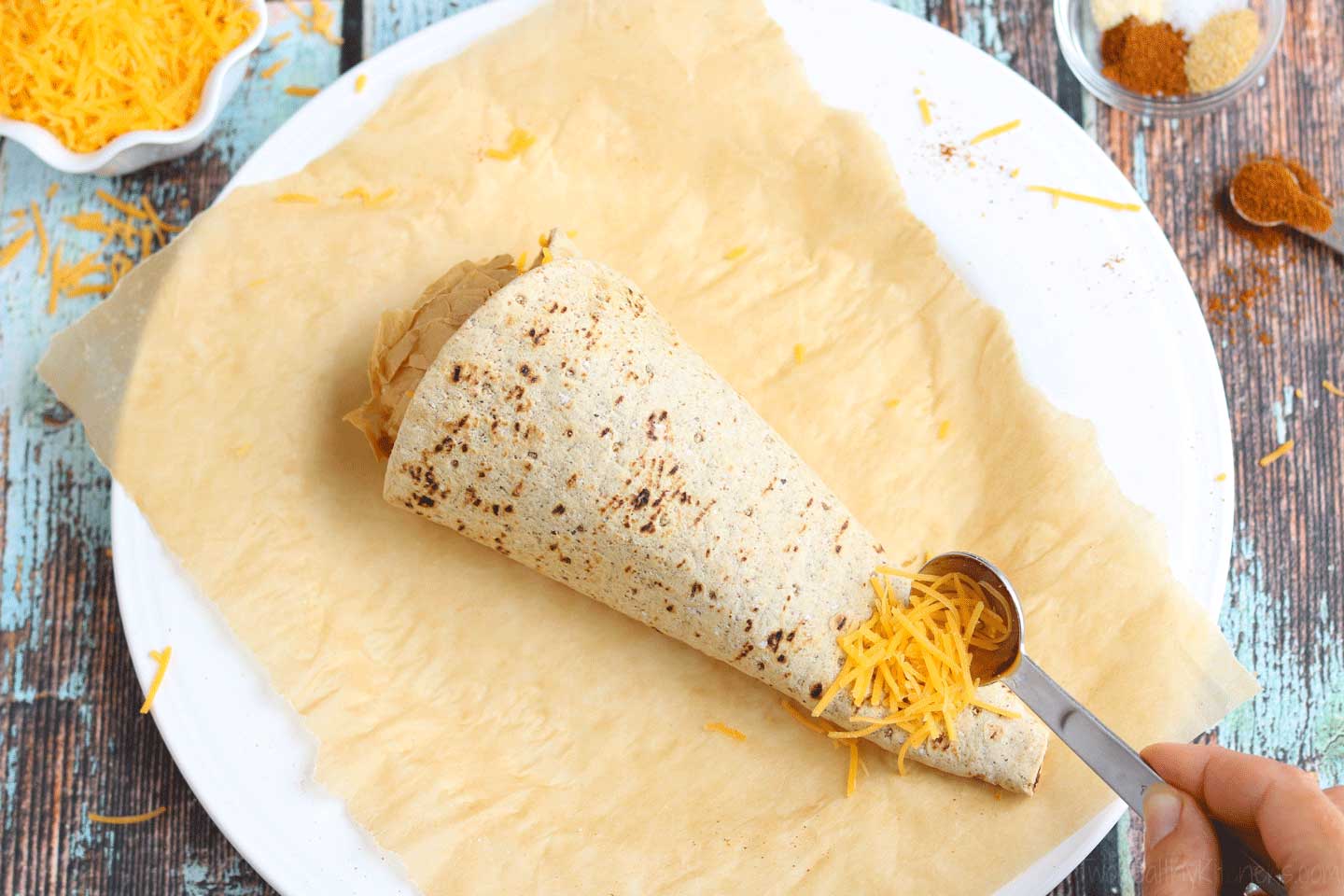 Next, sprinkle a little cheese near the end of your cone and microwave briefly again.