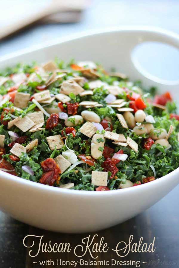 Loaded with so much great flavor and texture in every bite! This Tuscan Kale Salad with Honey-Balsamic Vinaigrette is so incredibly delicious ... you won't even notice how healthy it is! Seriously! Featuring tangy feta and parmesan, two kinds of tomatoes, cannellini beans, roasted red peppers, and fresh basil … all draped in a simple honey-balsamic vinaigrette dressing! #kale #salad #superfood #healthyrecipes #saladdressing #vinaigrette #kalesalad #greens #sponsored | www.TwoHealthyKitchens.com