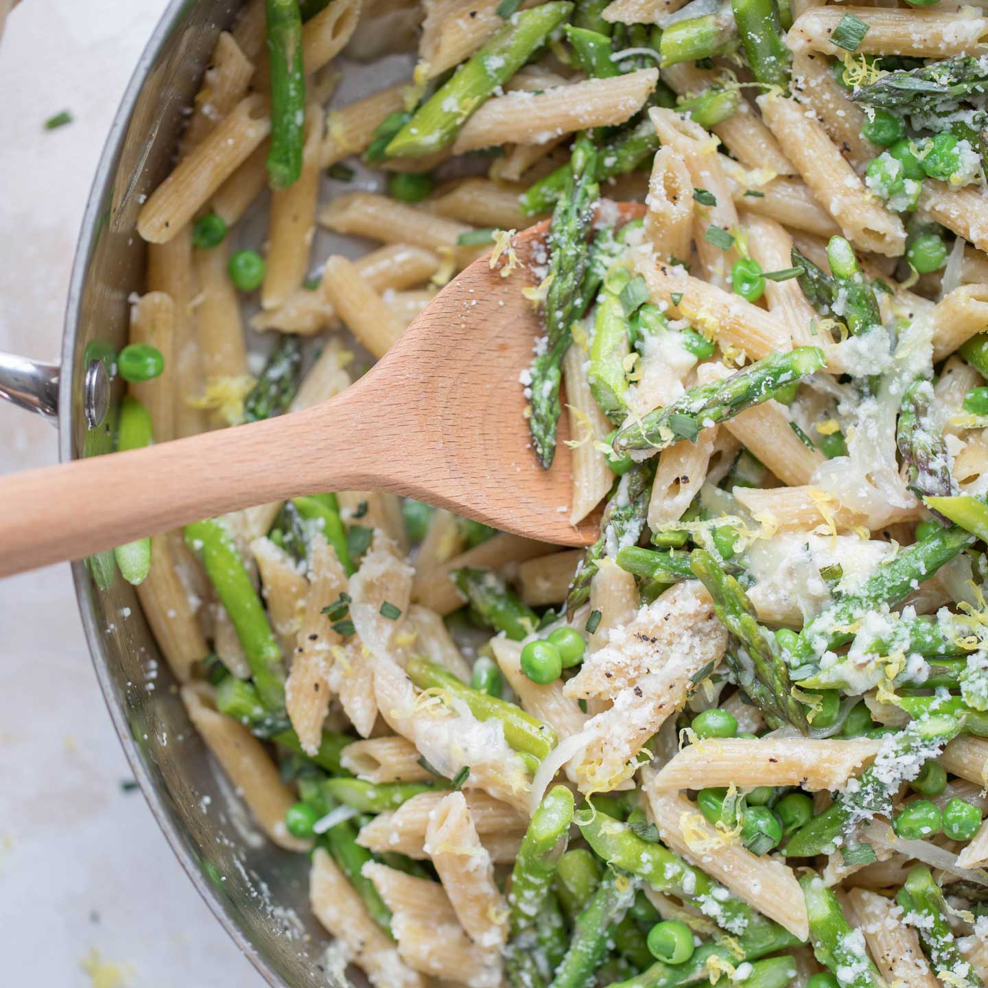 Dish up big, big comforting flavors with this whole-wheat pasta with asparagus, peas, parmesan, shallot, lemon and tarragon. So much to love about this vibrantly delicious skillet meal!