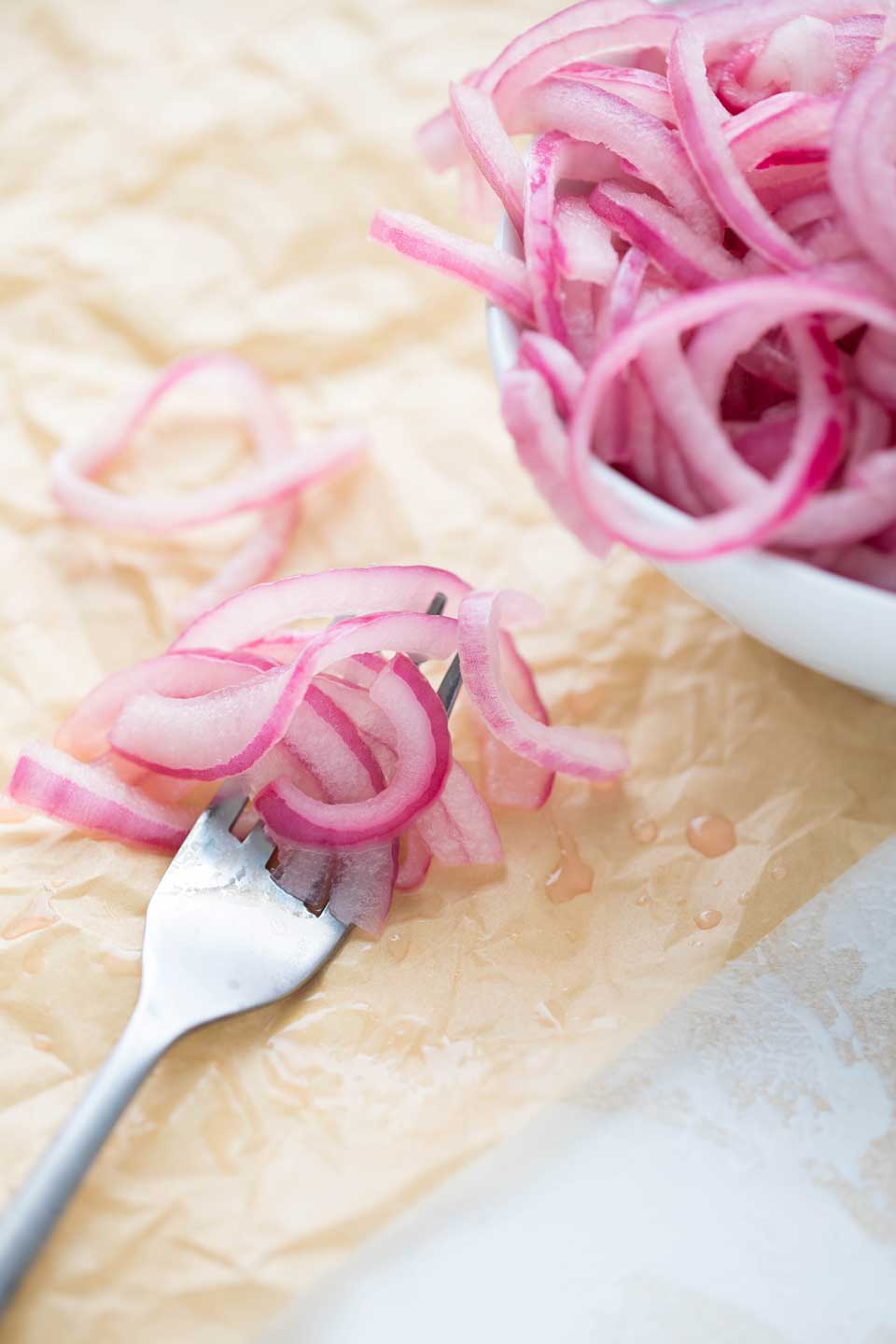 Just three ingredients is all you need for these amazingly flavor-packed Quick-Pickled Onions! They’re a surprisingly delicious twist, spread across our Rotisserie Chicken Tacos. But you’ve also gotta try them on sandwiches, salads … even hummus!