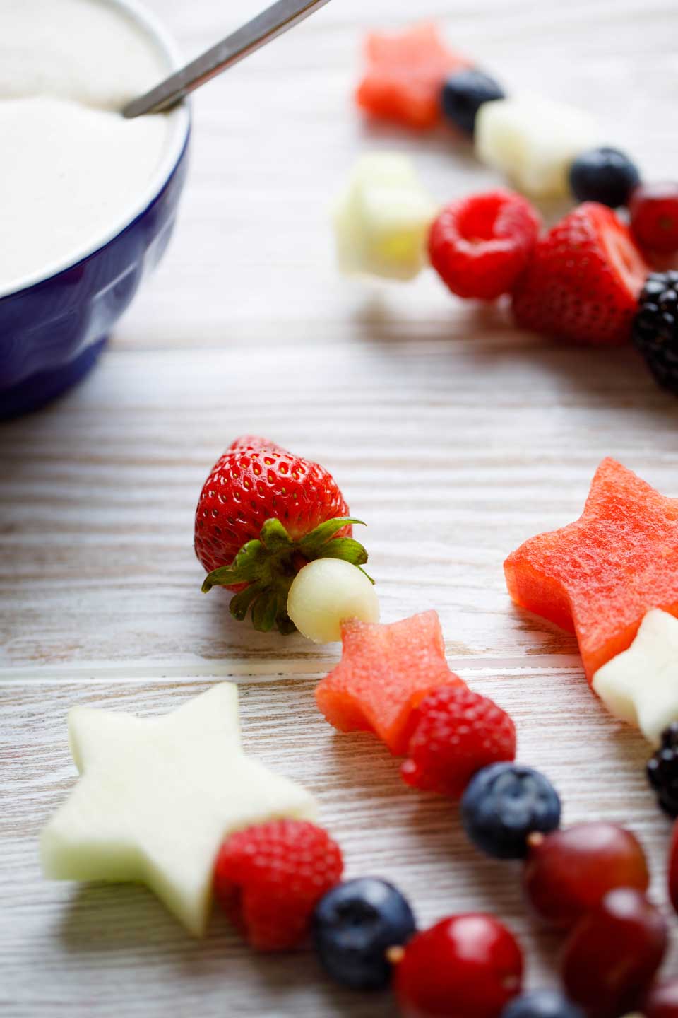 Easy and fun as appetizers or dessert! With our quick tips, you can serve Red, White and Blue Fruit Kabobs as a refreshing appetizer with sweet Yogurt Dip, or as a light but decadent dessert with cake and Chocolate Lava Dip! Plus fun serving ideas, too! Make these for all your summer picnics and BBQs ... from Memorial Day to 4th of July to Labor Day! #picnic #patriotic #redwhiteandblue #fruit #kabobs #appetizer #healthy #dessert #partyfood #4thofJuly #fourthofjuly | www.TwoHealthyKitchens.com