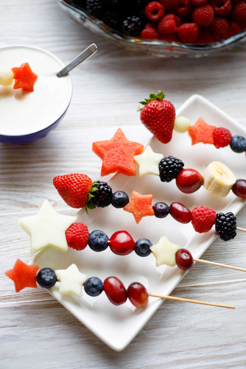 Easy and fun as appetizers or dessert! With our quick tips, you can serve Red, White and Blue Fruit Kabobs as a refreshing appetizer with sweet Yogurt Dip, or as a light but decadent dessert with cake and Chocolate Lava Dip! Plus fun serving ideas, too! Make these for all your summer picnics and BBQs ... from Memorial Day to 4th of July to Labor Day! #picnic #patriotic #redwhiteandblue #fruit #kabobs #appetizer #healthy #dessert #partyfood #4thofJuly #fourthofjuly | www.TwoHealthyKitchens.com