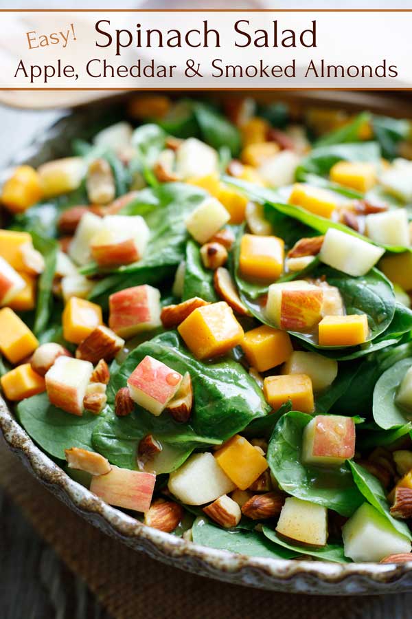 An absolute favorite! So, so good – but it takes just 10 minutes! With only a few simple ingredients (and make-ahead steps) this easy Spinach Salad with Apple, Cheddar and Smoked Almonds is quick enough for busy weeknights, but it effortlessly dresses up for entertaining, too. Try it once, and it’s sure to become a go-to family favorite! | spinach recipes | spinach salad recipes | spinach salad dressing | fall salads | apple recipes | #healthy #spinach #salad #apples | www.TwoHealthyKitchens.com