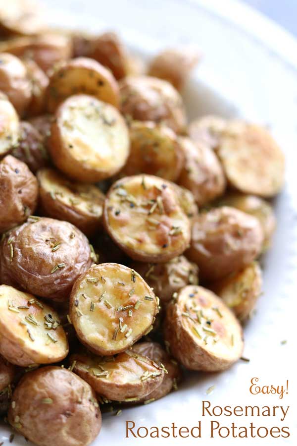 The perfect side for practically any meal! These super-easy Rosemary Roasted Potatoes will become a go-to side dish for everything from grilled burgers and roasted chicken to dinner-party salmon! Just a few ingredients you can keep on hand in the pantry – it’s an absolute snap to throw this simple side dish recipe together anytime! Plus, check out our tips for PERFECT roasted red potatoes, every time! | roasted potatoes | red potato recipes | roasted vegetables | www.twohealthykitchens.com