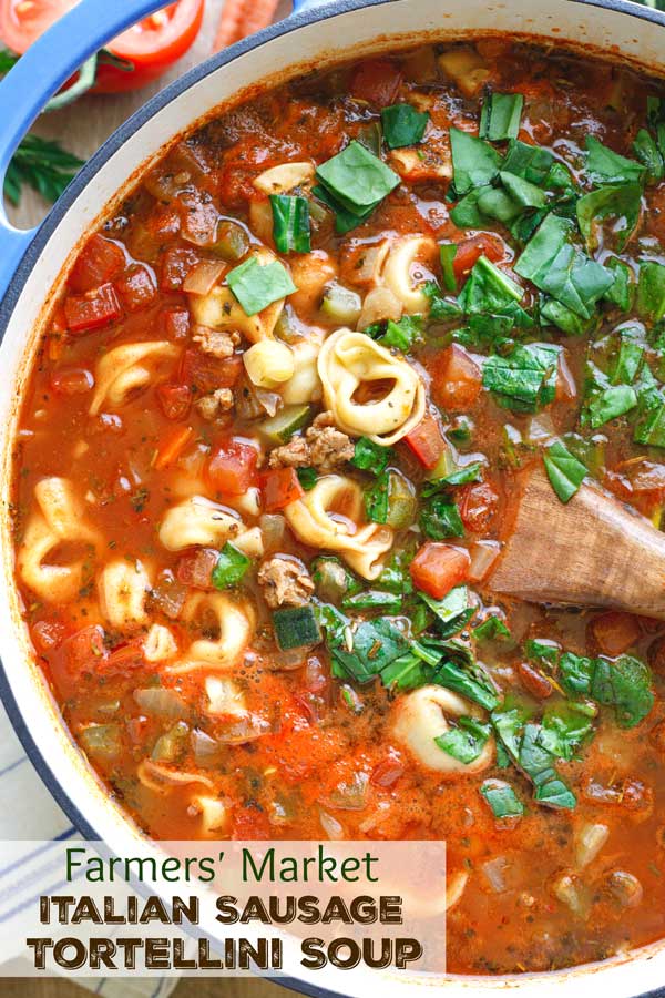 A true family favorite! This Farmers’ Market Italian Sausage-Tortellini Soup recipe is absolutely delicious – so deeply flavorful and satisfying! Bursting with savory sausage, pillowy tortellini, and vibrant, fresh veggies! It’s great for using up summer vegetables ... but easy to make in winter with grocery store veggies, too! Make this beloved, quick and easy soup recipe all year ‘round! | tortellini recipes | soup recipes | soup recipes healthy | vegetable soup | www.TwoHealthyKitchens.com
