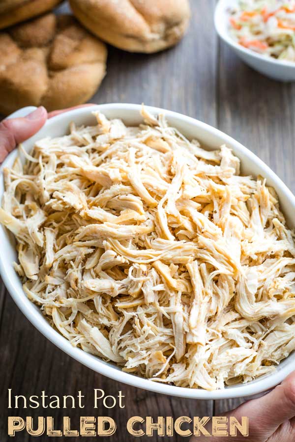 Only 5 ingredients and 5 minutes of prep – so EASY in your pressure cooker! Your family will love the tender, flavorful pulled chicken in our popular Carolina-Style Instant Pot BBQ Chicken Sandwiches! Pile it high on soft buns with a side of slaw – DELICIOUS! This recipe is a reader favorite – try it and you’ll see why! | Instant pot recipes easy | instant pot chicken recipes | pressure cooker recipes | pressure cooker chicken | chicken recipes | shredded chicken | www.TwoHealthyKitchens.com