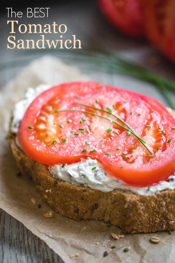 closeup photo of one sandwich with the text "The BEST Tomato Sandwich"