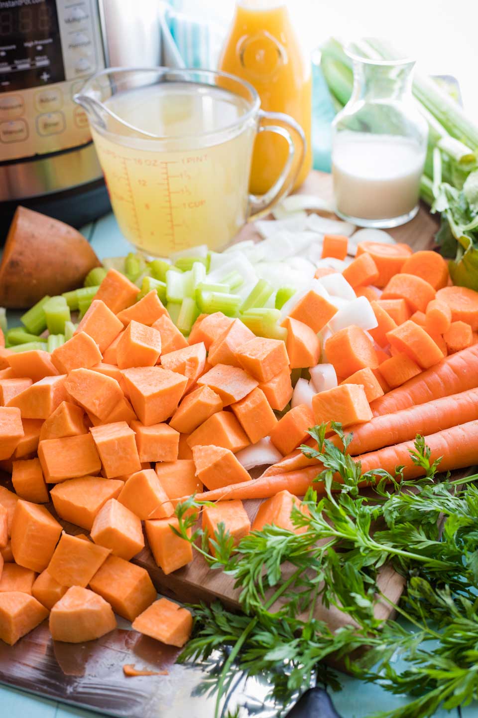 prepared soup ingredients - chopped sweet potatoes, carrots, celery, and onions
