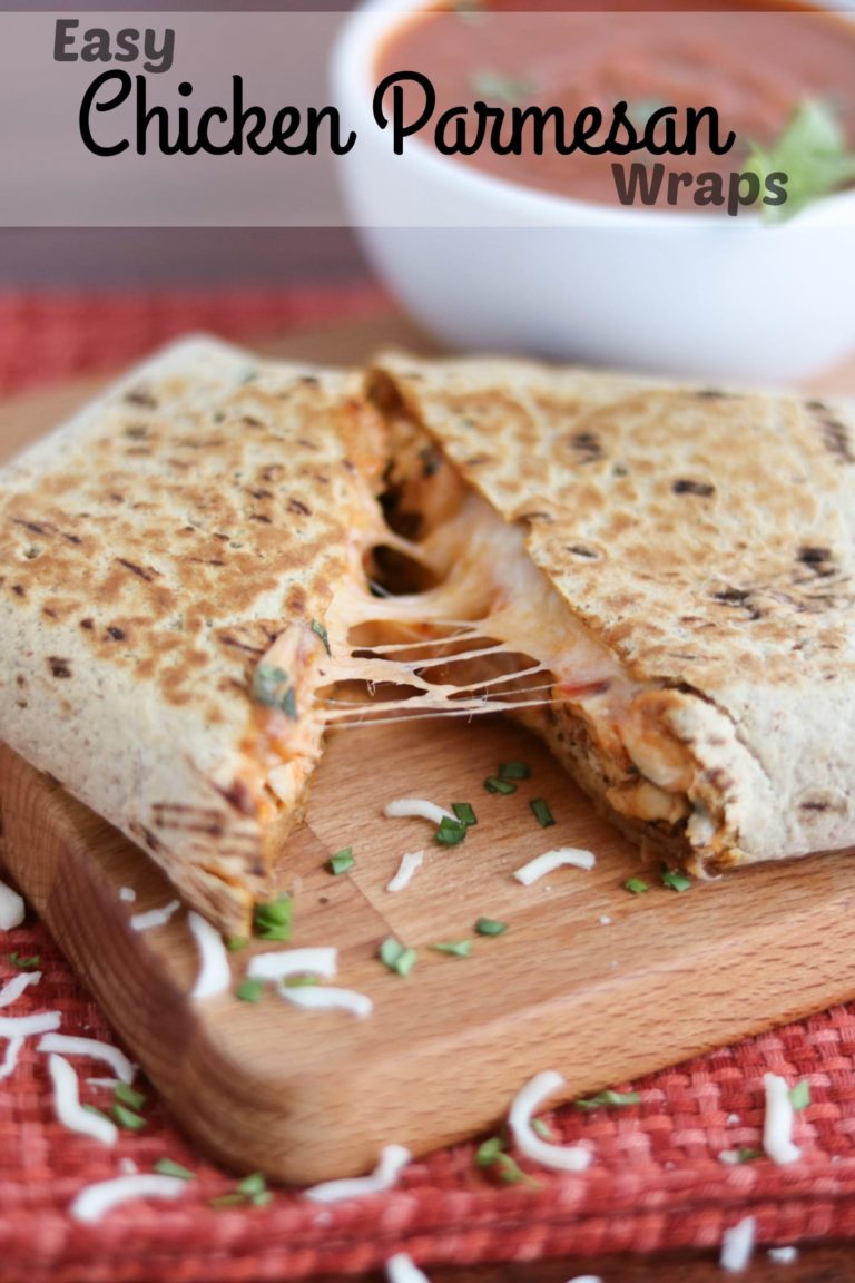 Pinnable photo of cut-open wrap with cheese pull, with text "Easy Chicken Parmesan Wraps".