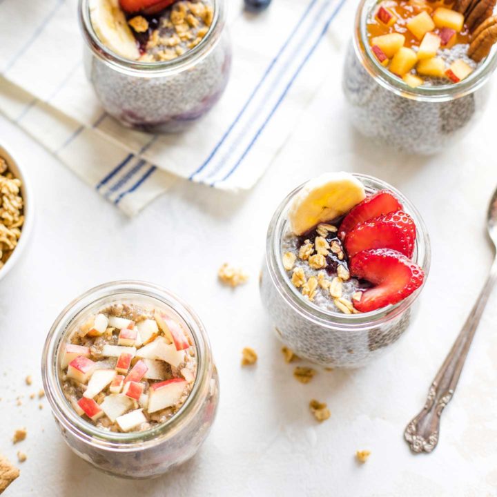 Several jars of chia pudding with different toppings combinations.