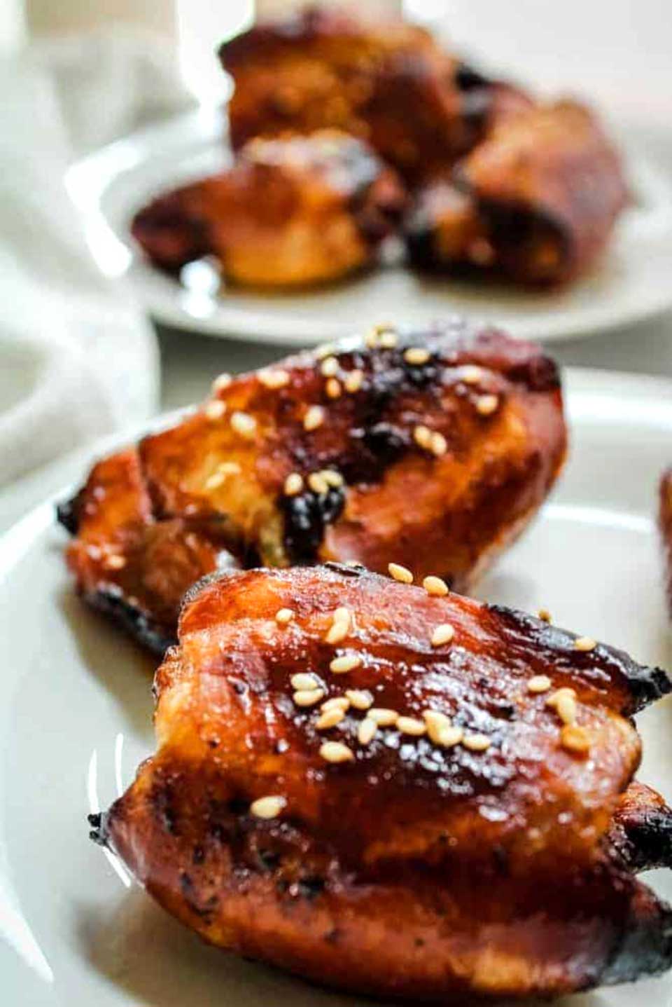 Thighs with Honey Soy Marinade, presented on white plates.