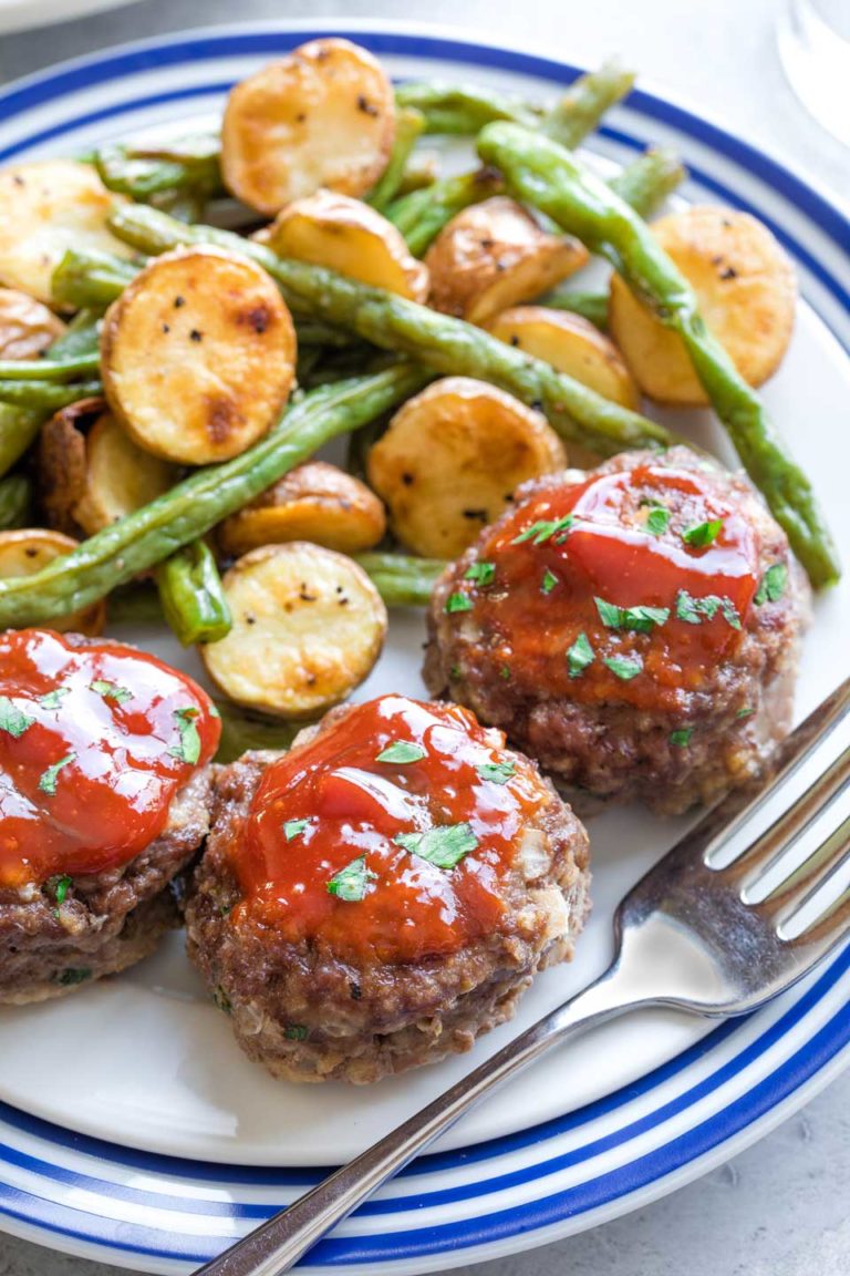 Serving suggestion of meatloaf muffins with roasted potatoes and beans.