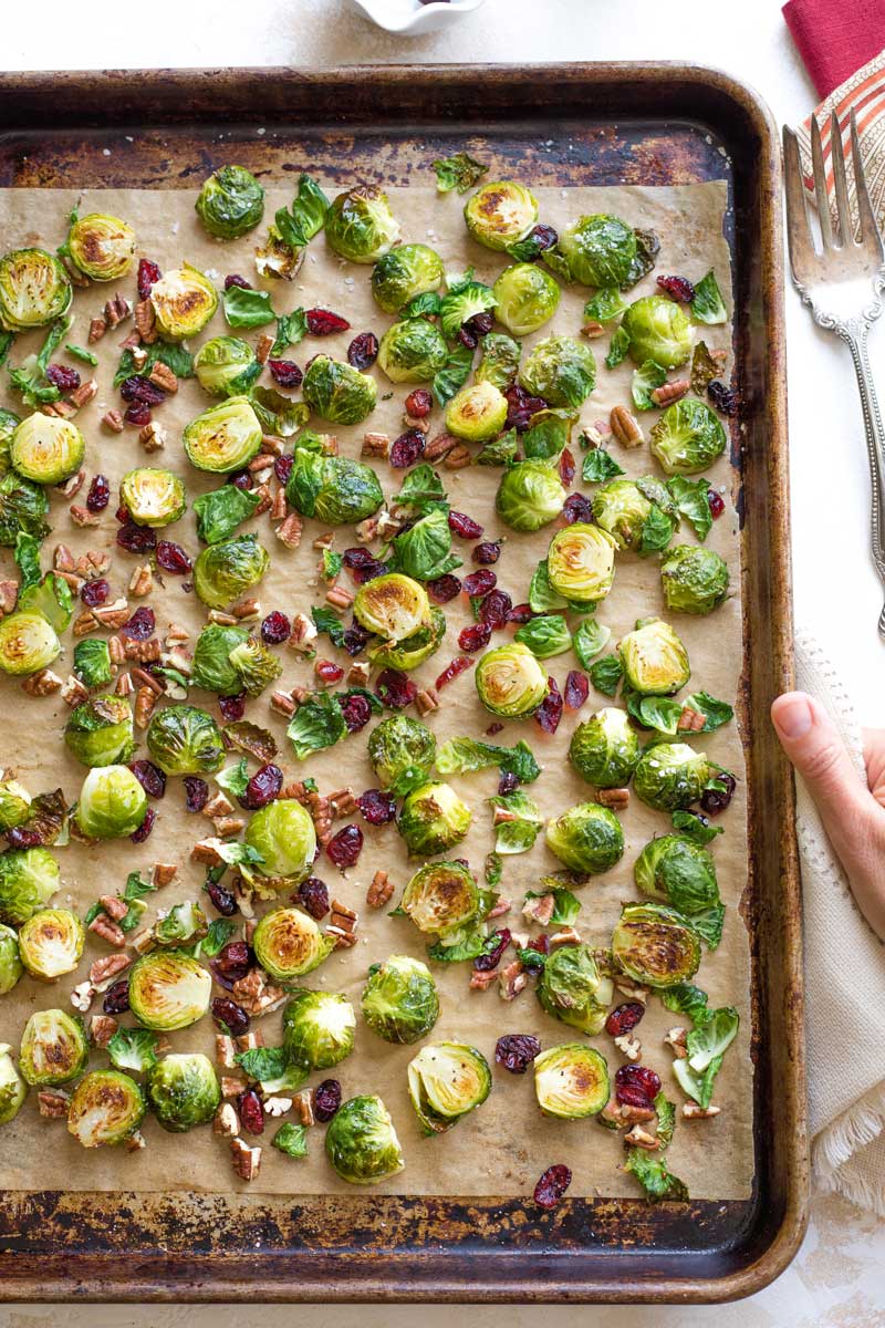 Overhead of sheet pan after Brussels sprouts have been roasted and are ready to serve.