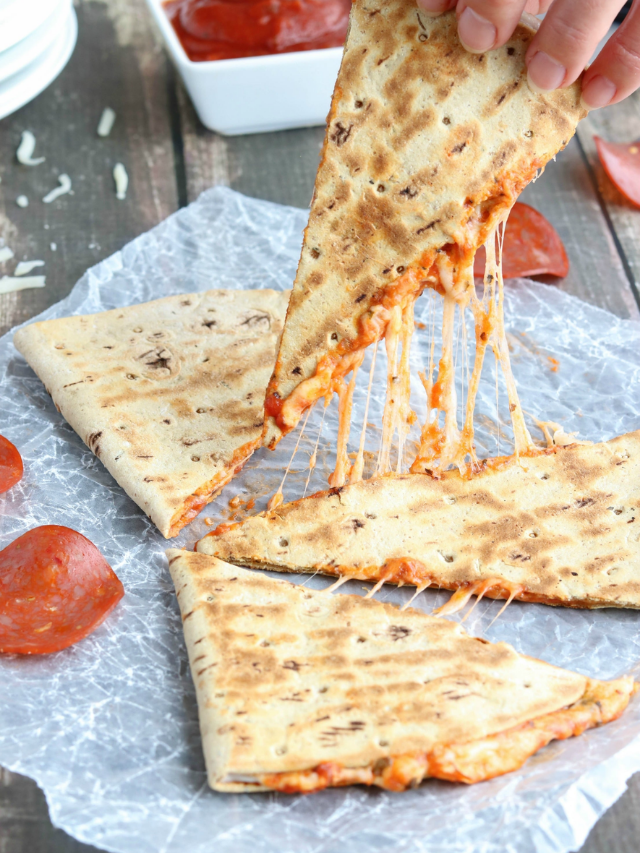 Cheesy Pepperoni Pizza Quesadilla Cover Image for Web Story of hand picking up one wedge with cheese pull.