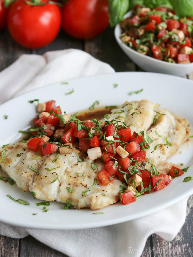 Caprese Grilled Fish Cover image of whole filet with topping on serving platter and extra topping behind.