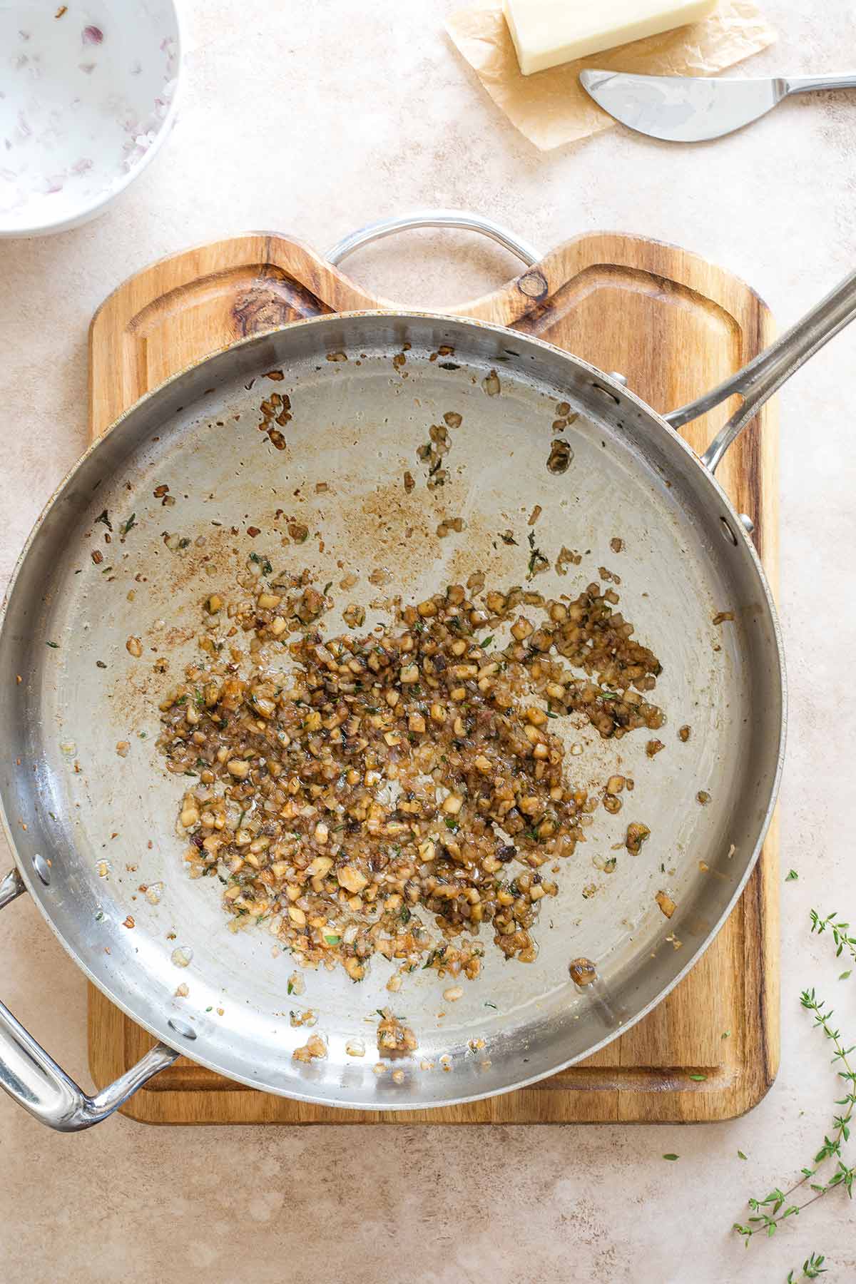 Overhead of cooked mushroom duxelles in skillet.